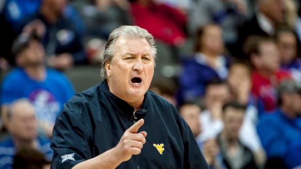 West Virginia Mountaineers head coach Bob Huggins yells during the first half against the Kansas Jayhawks in the semifinals of the Big 12 conference tournament at Sprint Center.